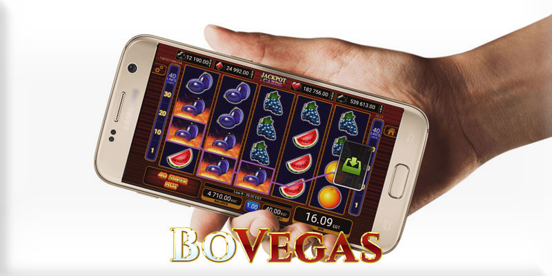 Online Casino Hand holding phone with online casino on it