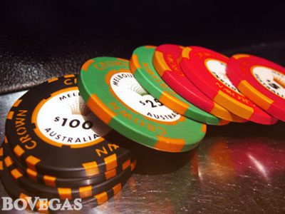 Casino chips laying on top of each other 