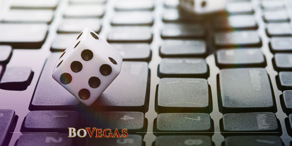 Dices on keyboard represent Online Gambling