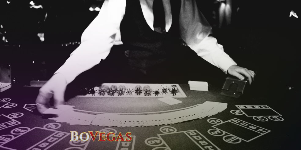 Croupier in Casino Deals Cards